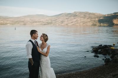 Bride & Groom pose lakefront