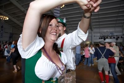 A couple dancing in October fest near Marv Herzog Hotel