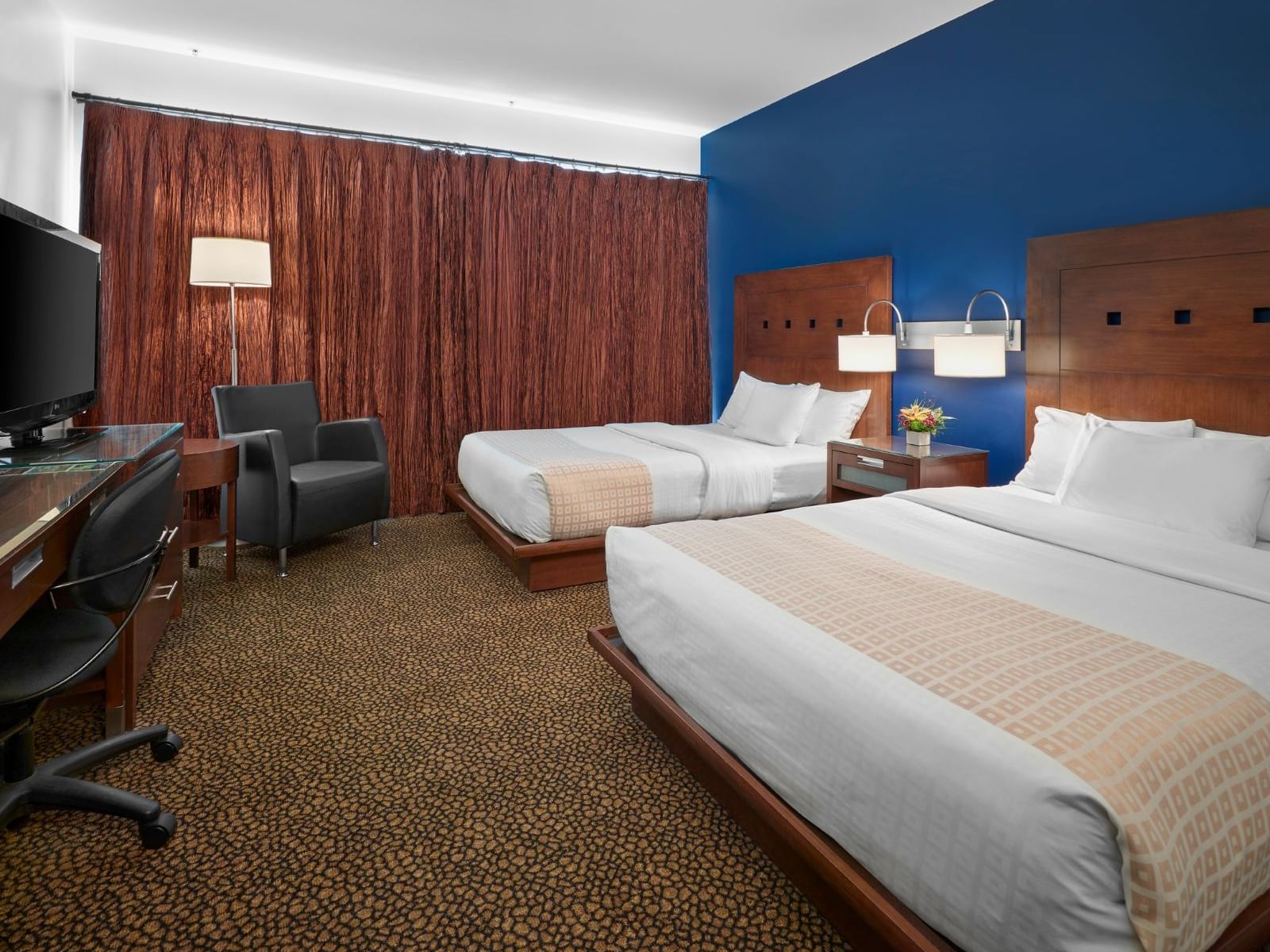 Bed & furniture in Deluxe king Room at Metterra Hotel on Whyte