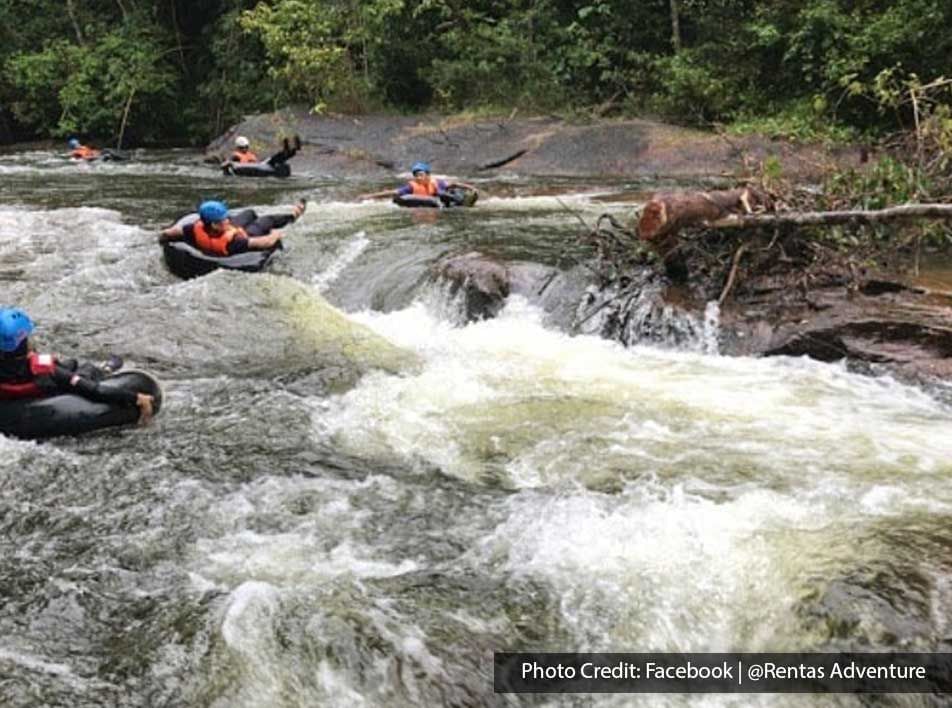 A group of people were engaging in a water tubing activity - Lexis Suites Penang