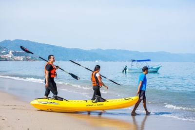People Kayaking on the beach at Buenaventura Grand Hotel