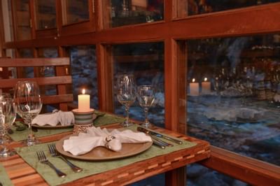 dining table with place settings with river view
