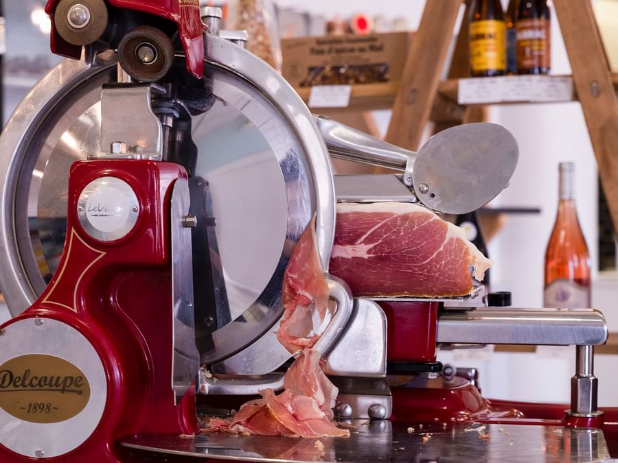 Close up on a meat grinding machine at Hotel Millau South