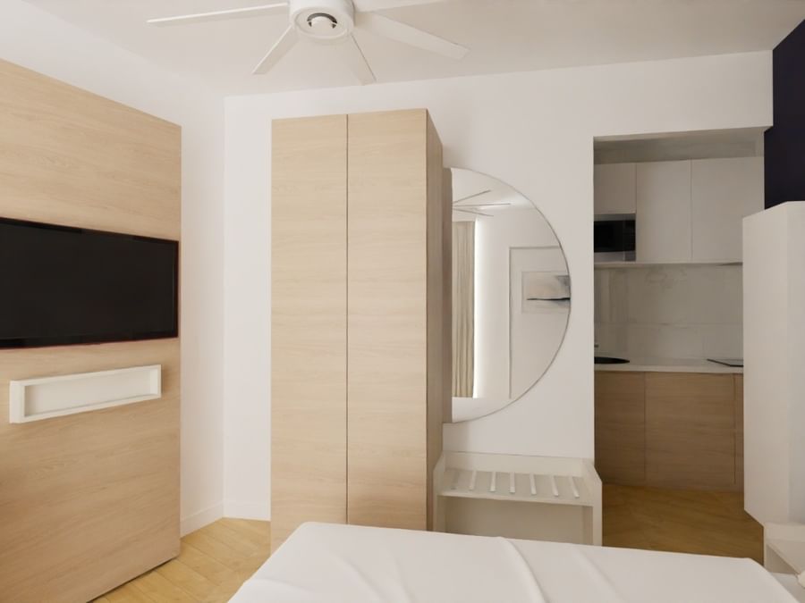 Chambre Appart Confort avec lit, placard, TV, et cuisinette chez Les Sources Callou à Vichy.