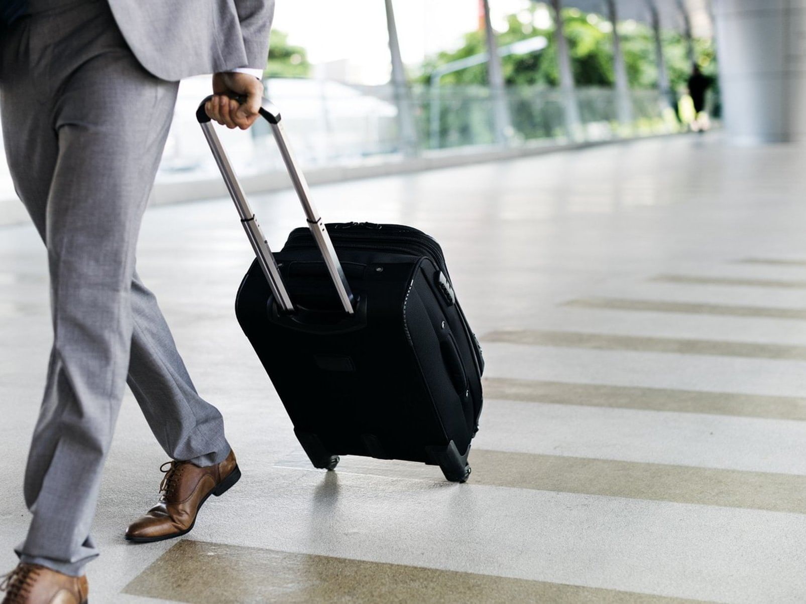 Close-up of a man walking with luggage at Jamaica Pegasus Hotel