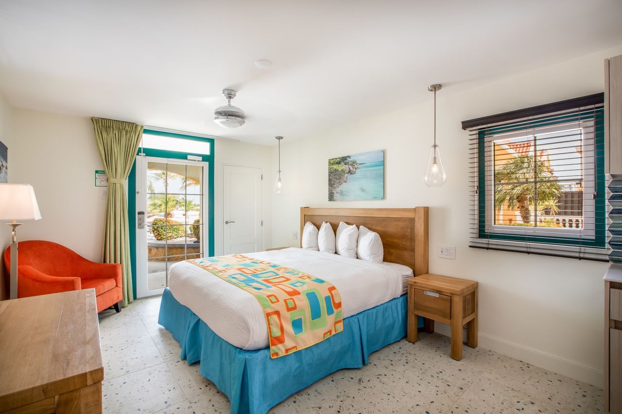 Cozy bedroom featuring a king bed with an outdoor view in Superior Studio at Amsterdam Manor Beach Resort