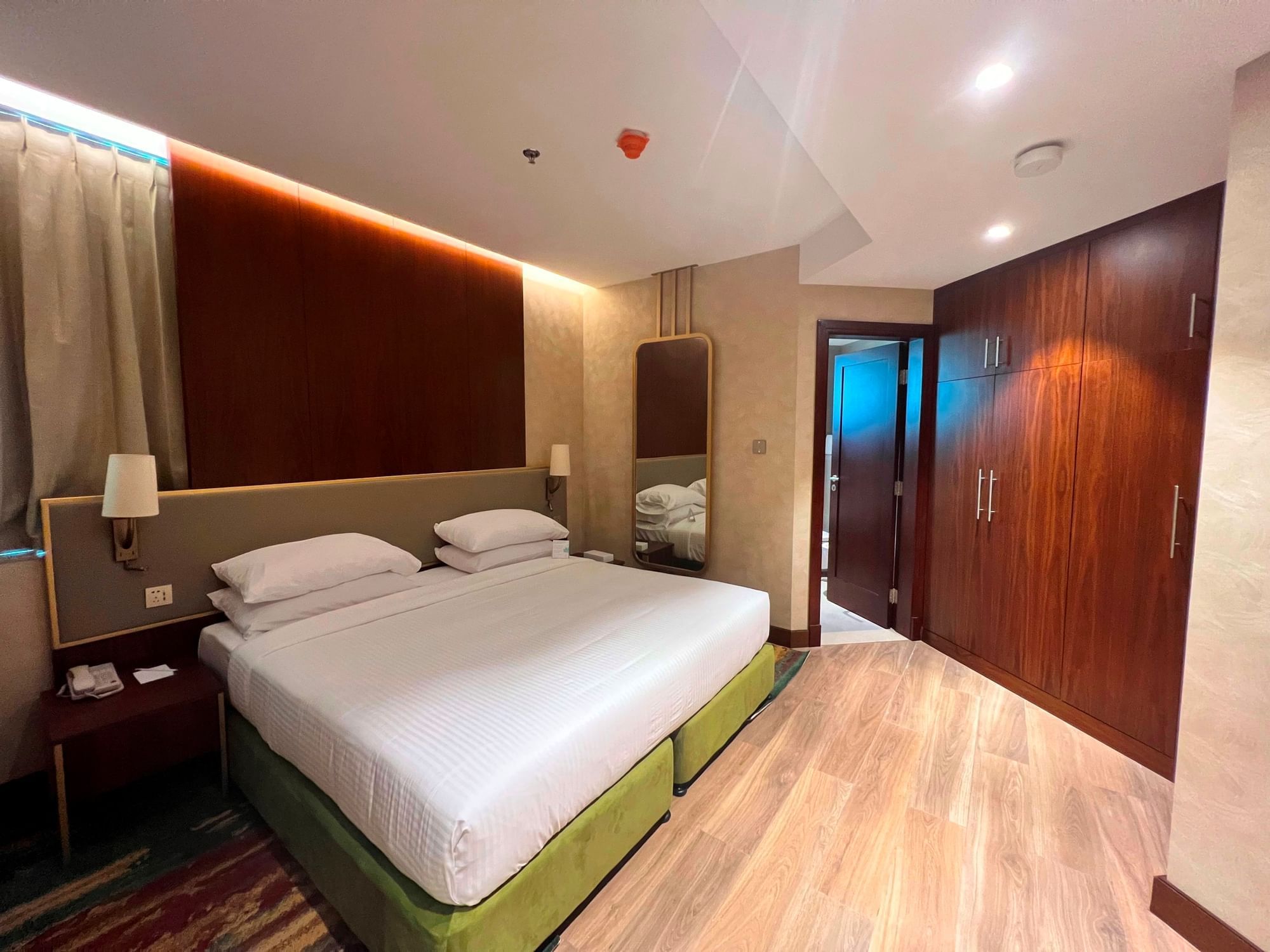 King bed in Deluxe One Bedroom Suite at City Seasons Hotels