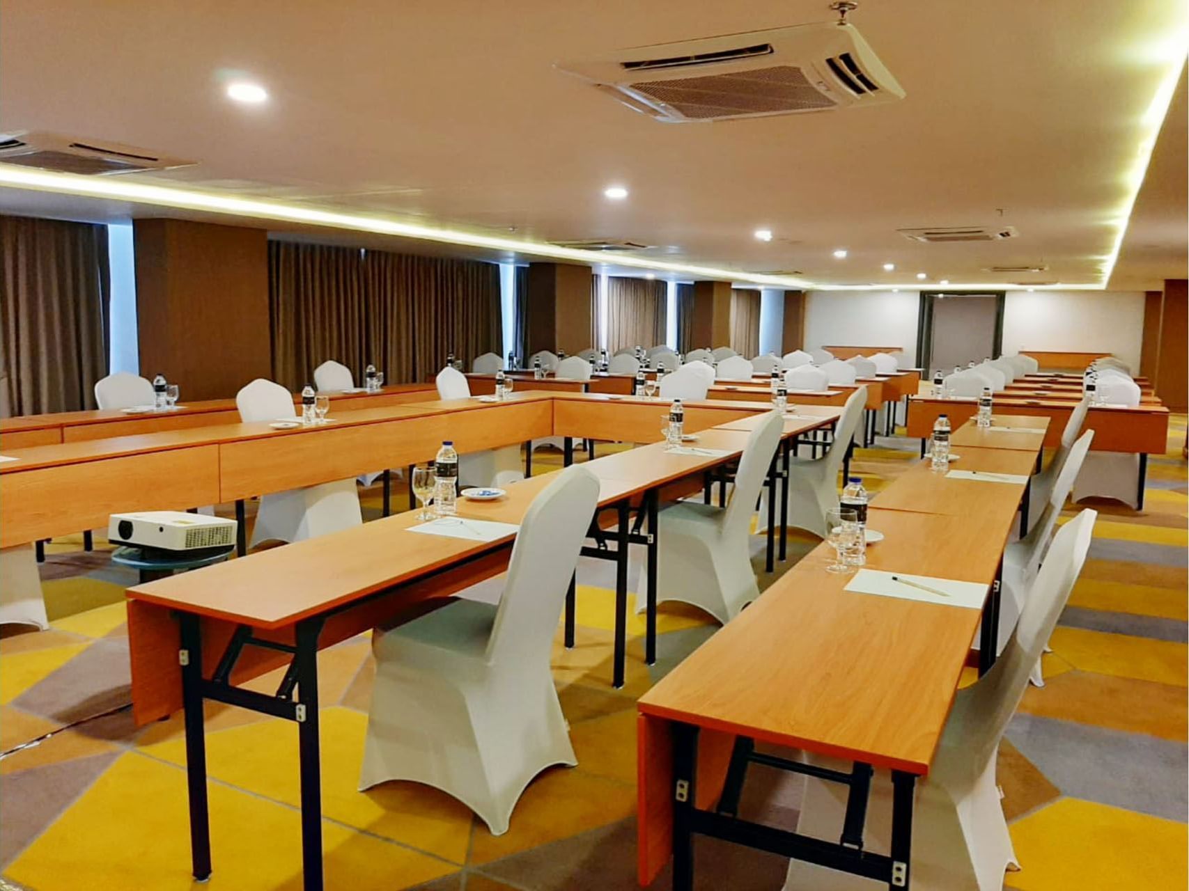 Classroom type event table set up in Meeting Room 4 at LK Pemuda Semarang Hotel & Residences