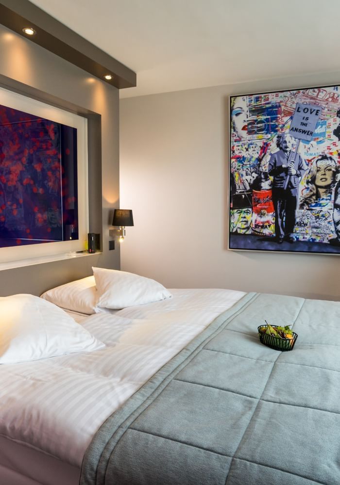 Art hung by the bed in Business Room at Starling Hotel Lausanne Switzerland accommodation