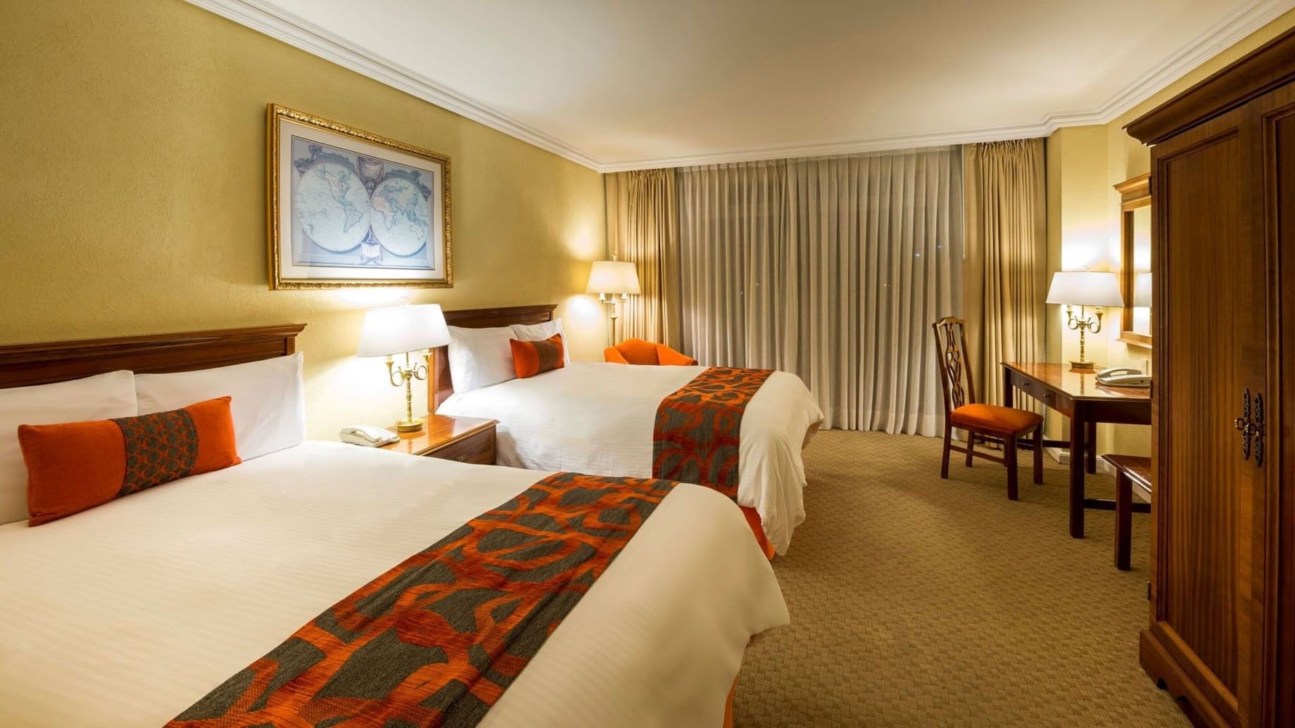2 Double Deluxe room featuring a classic world map and a dedicated work desk at Camino Real Puebla Angelopolis