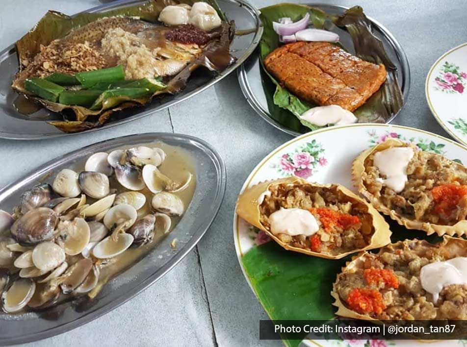 an array of seafood dishes served on silver platters