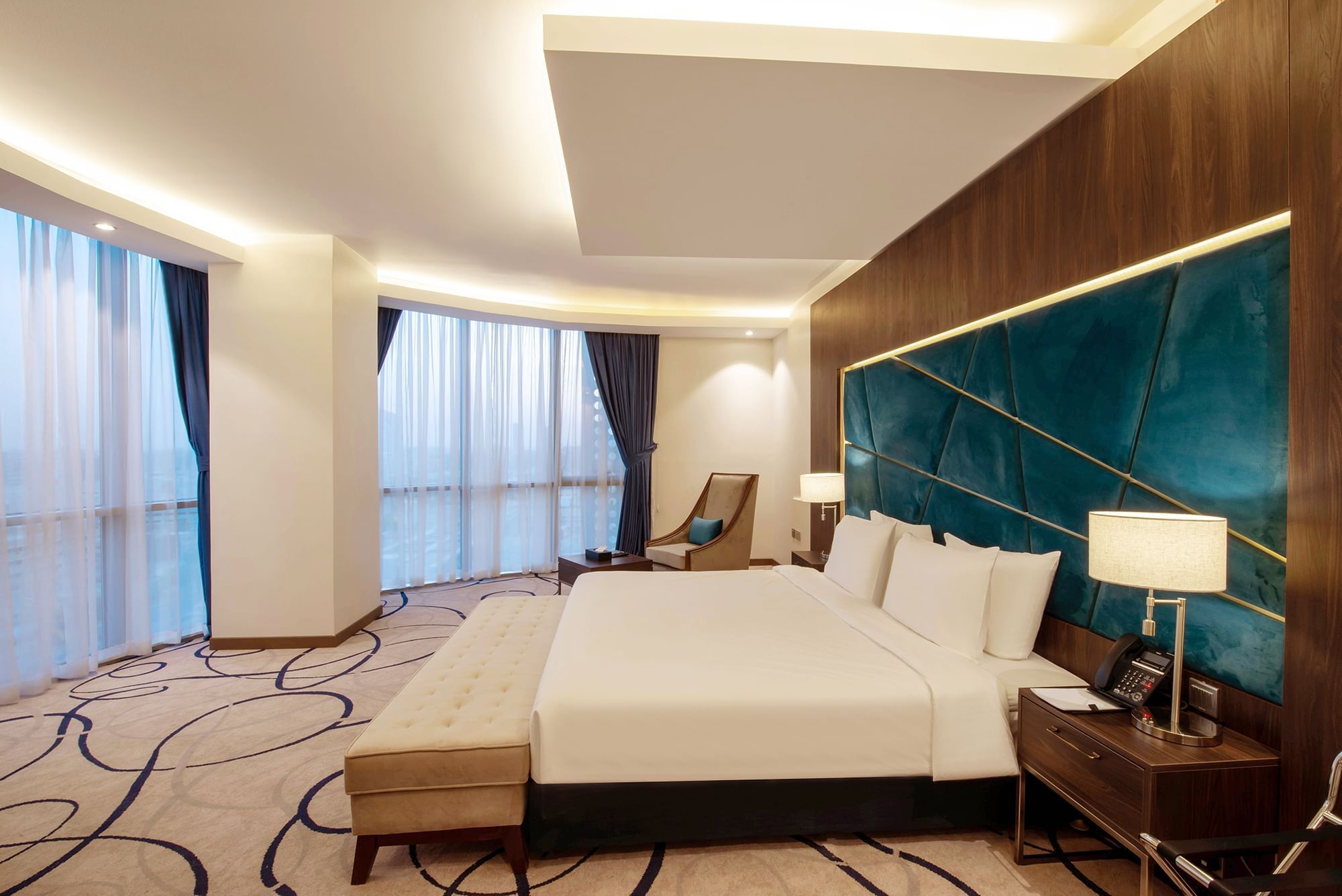 Panoramic Room with cozy bed with working area at Warwick Riyadh