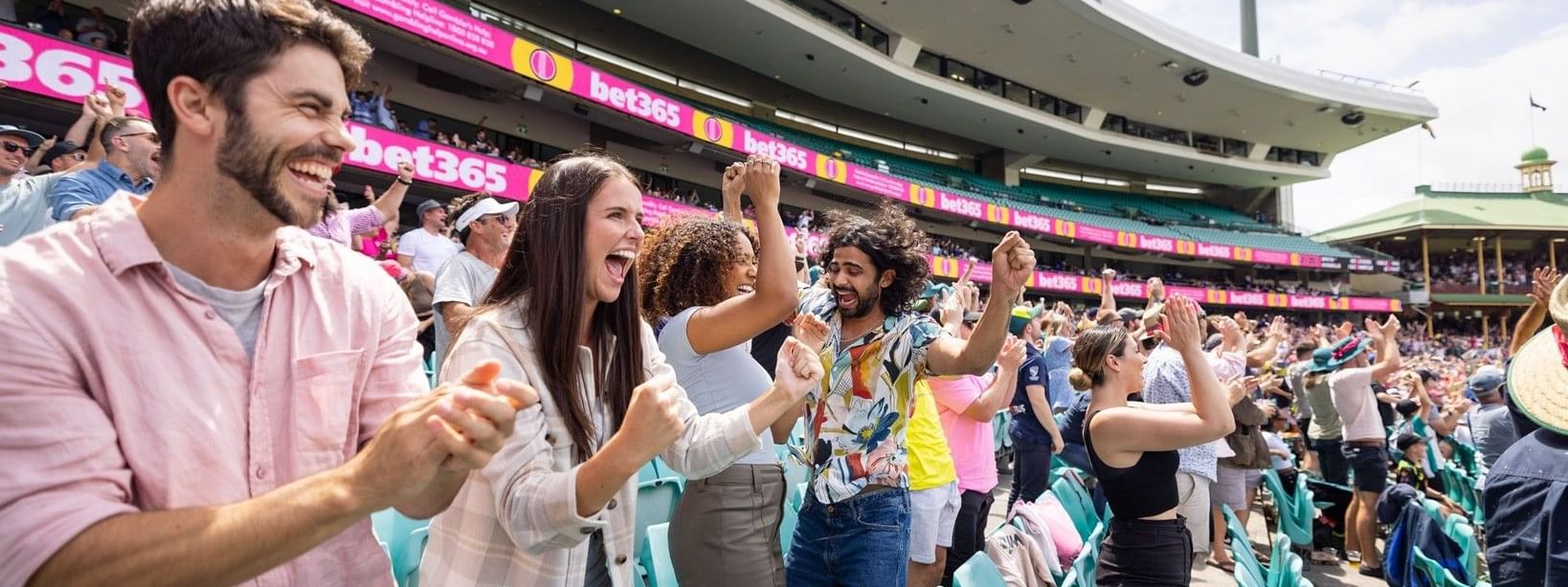 Excited crowd cheering at a cricket stadium during the Australia v England T20 International 2027 match