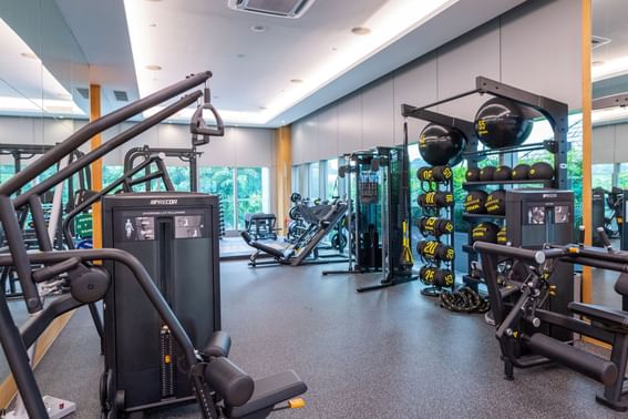 Various equipment & interior view of the gym at Carlton Hotels Singapore