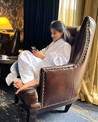 girl sitting in a leather chair