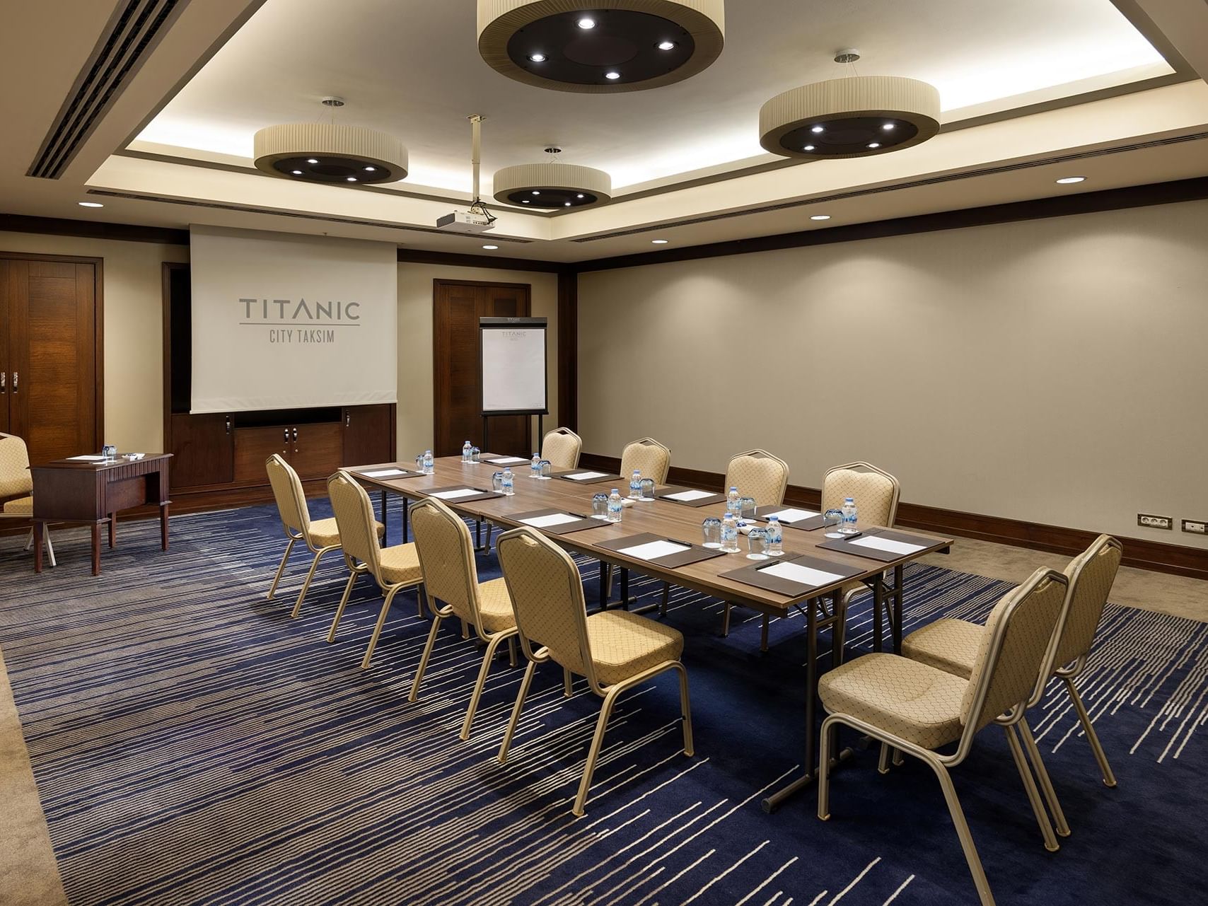 Borneo meeting room with boardroom layout and a projector screen in Titanic City Taksim.