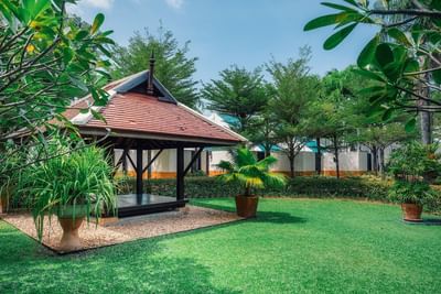 Lawn near the cottage and Saeng Chan Building at Paradox Resort Phuket