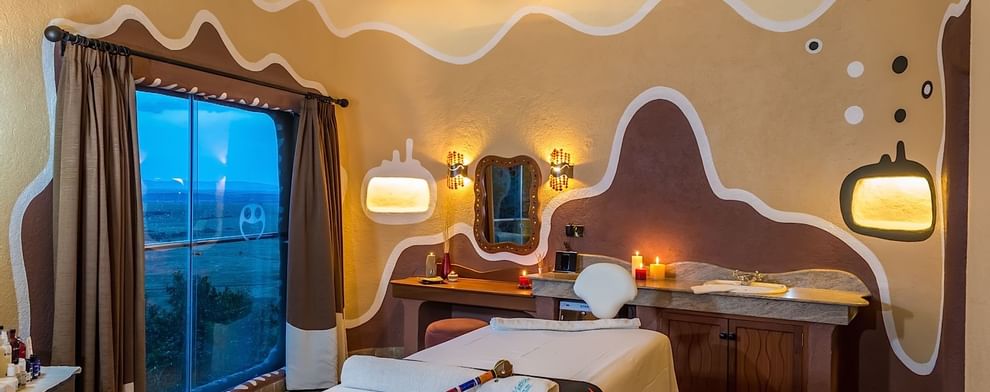 View of a treatment room with a bed at Mara Serena Safari Lodge