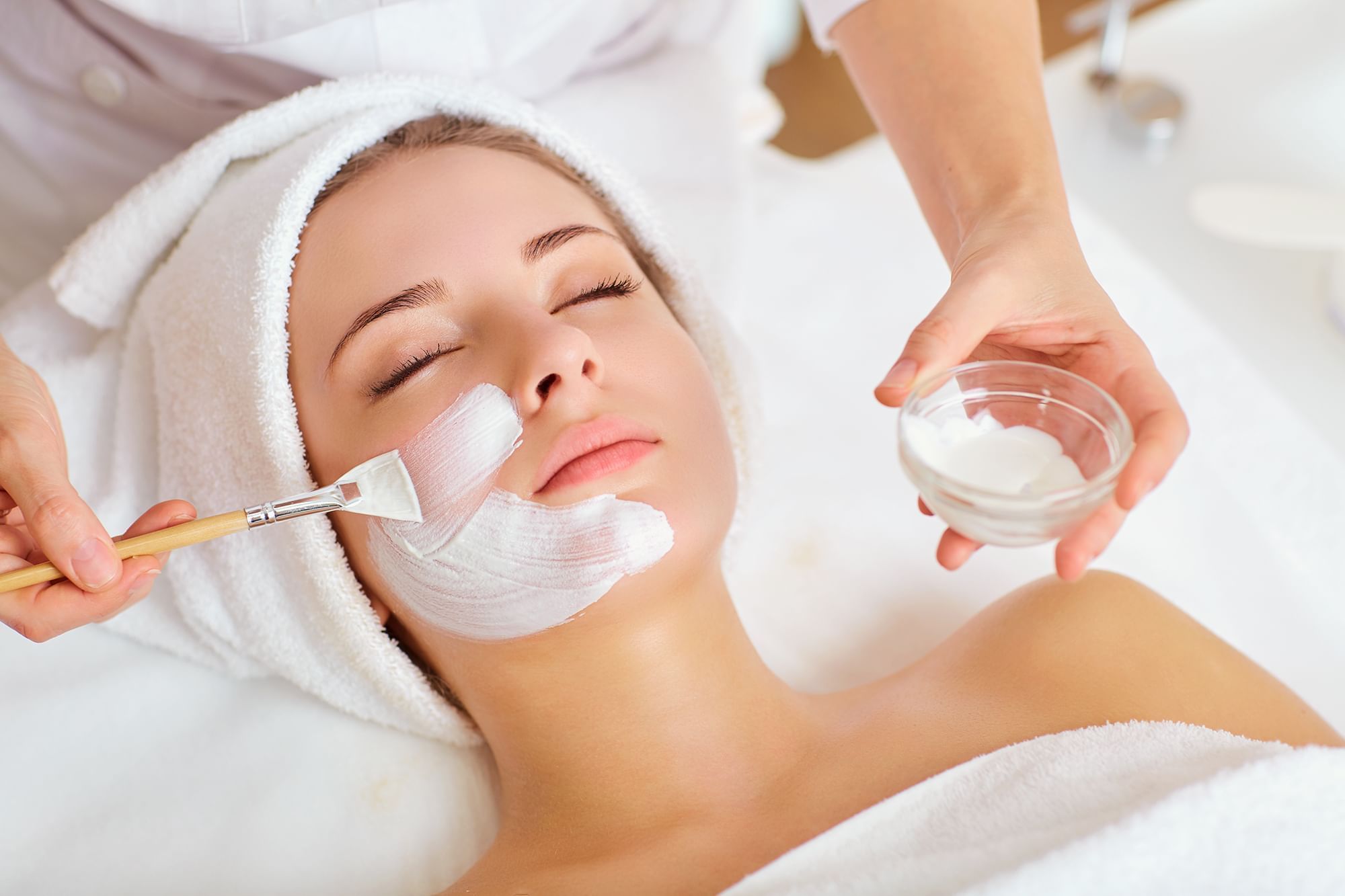 Lady receiving a Le Spa face treatment at The Spa by Warwick Melrose