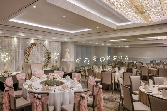 Wedding venue with banquet tables and floral decorations at York Hotel Singapore