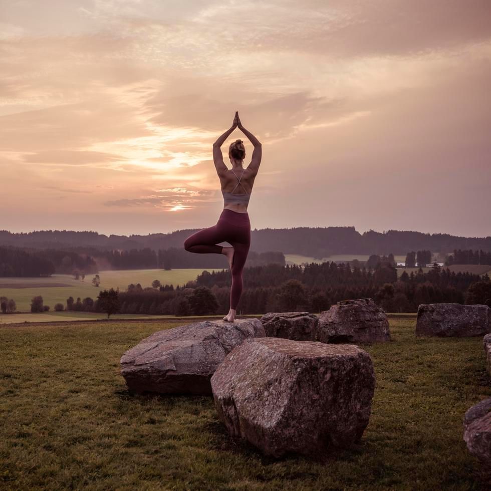 A Lady on yoga while watching the sunset, Falkensteiner Hotels