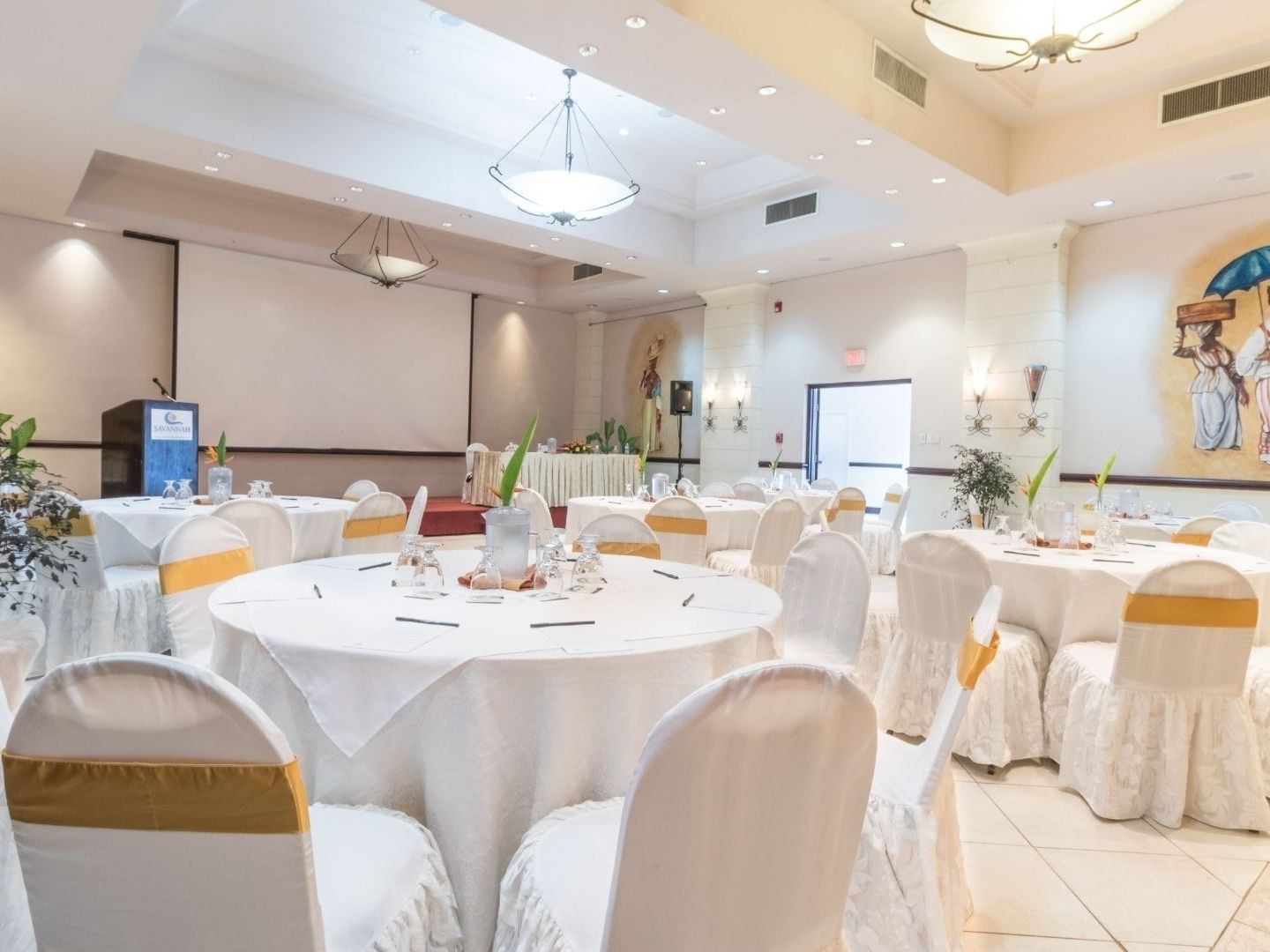 Banquet hall with tables and chairs at Savannah Beach Hotel.