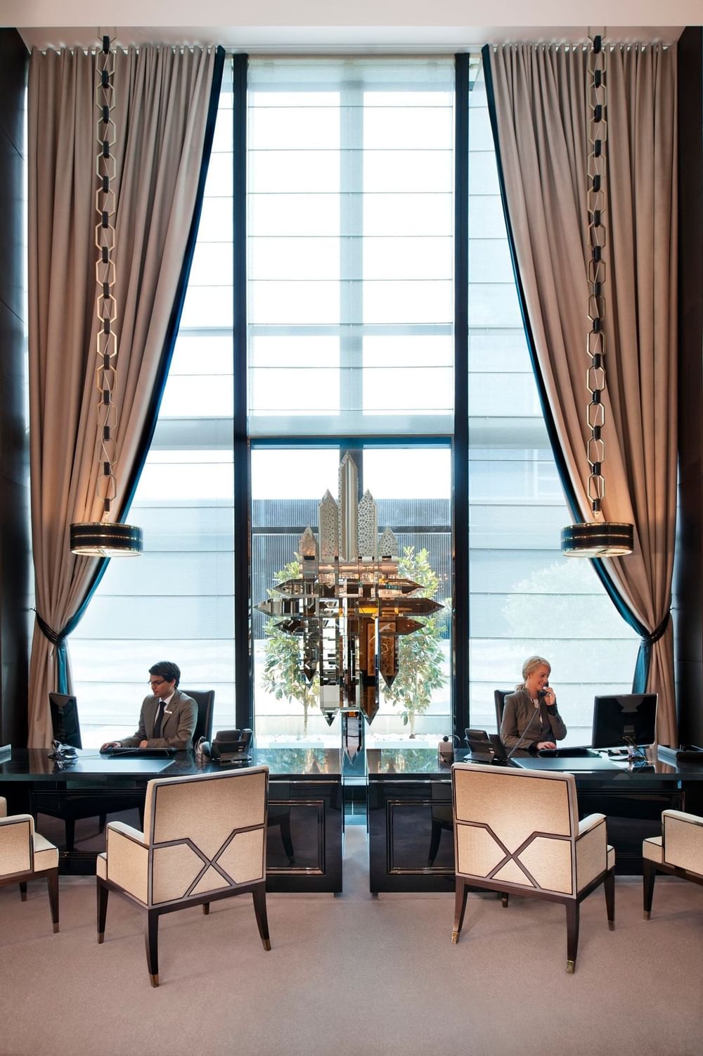 2 workers in Crystal Club front desk at Crown Towers Melbourne