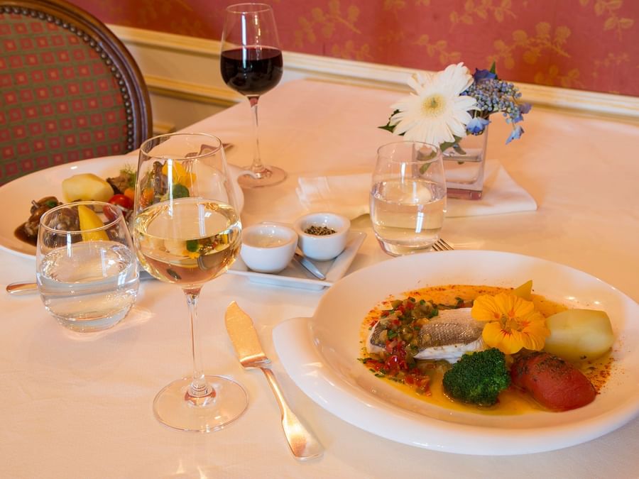 Closeup of Meals served with wine at Clos de Vallombreuse