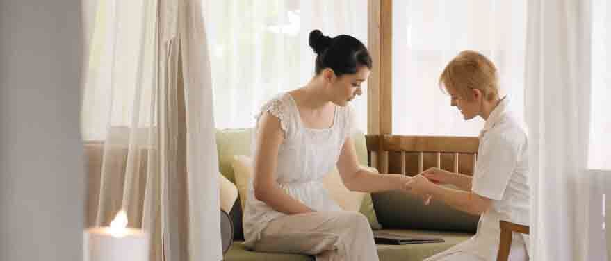 Lady in a consultation session in the Wellness spa at The Banjaran Hotsprings Retreat