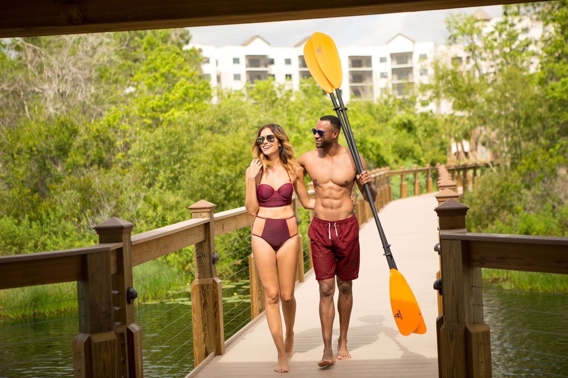 Couple walking on a pier at The Grove Resort and Water Park