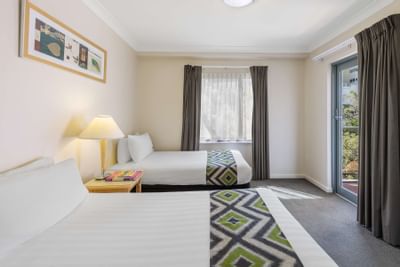 Twin beds in 3-Bedroom/2-Bathroom Apartments at Nesuto Hotels
