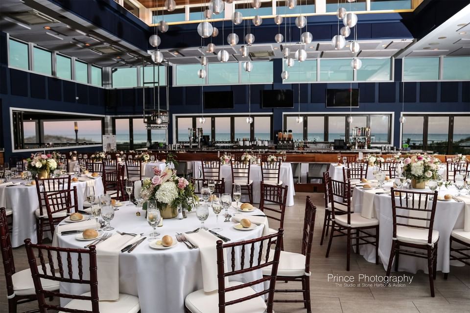 Round tables set in a banquet hall at our Avalon wedding venue