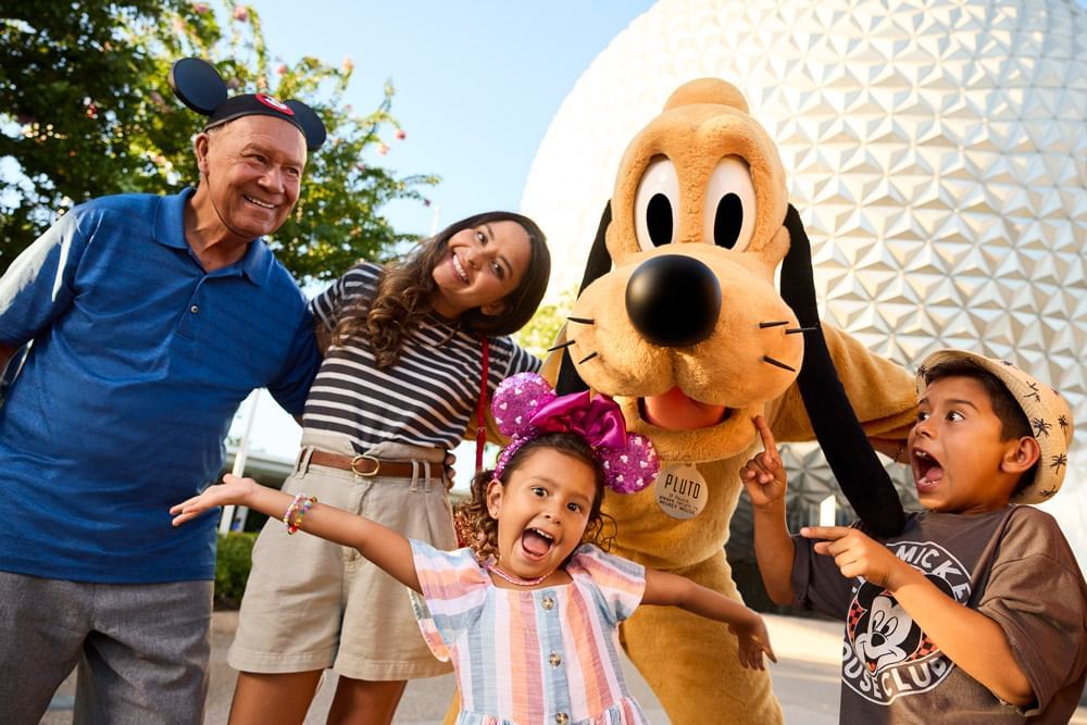Family posing by Walt Disney World's EPCOT near Lake Buena Vista Resort Village & Spa