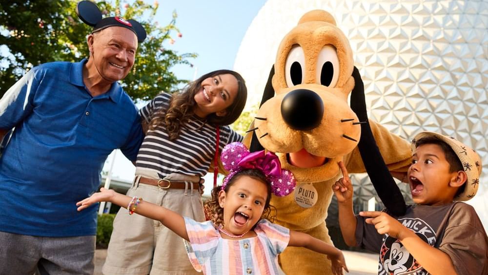 Family posing by Walt Disney World's EPCOT near Lake Buena Vista Resort Village & Spa