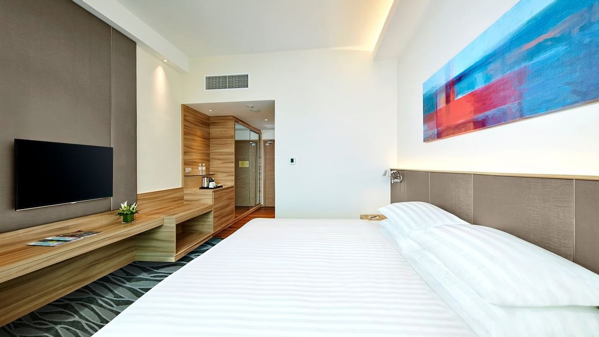 Mini work area with a TV & mirror in Deluxe Family King at Sunway Hotel Big Box