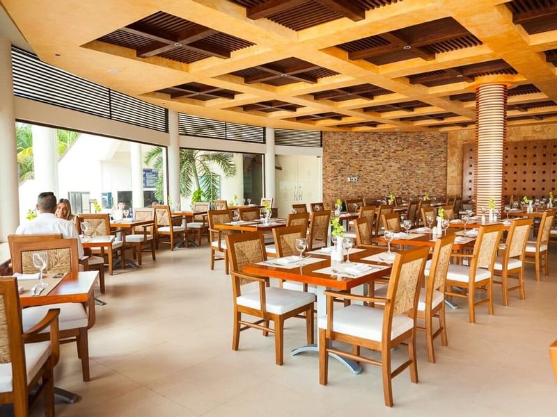 Elegant dining area in a restaurant at Reef Coco Beach 