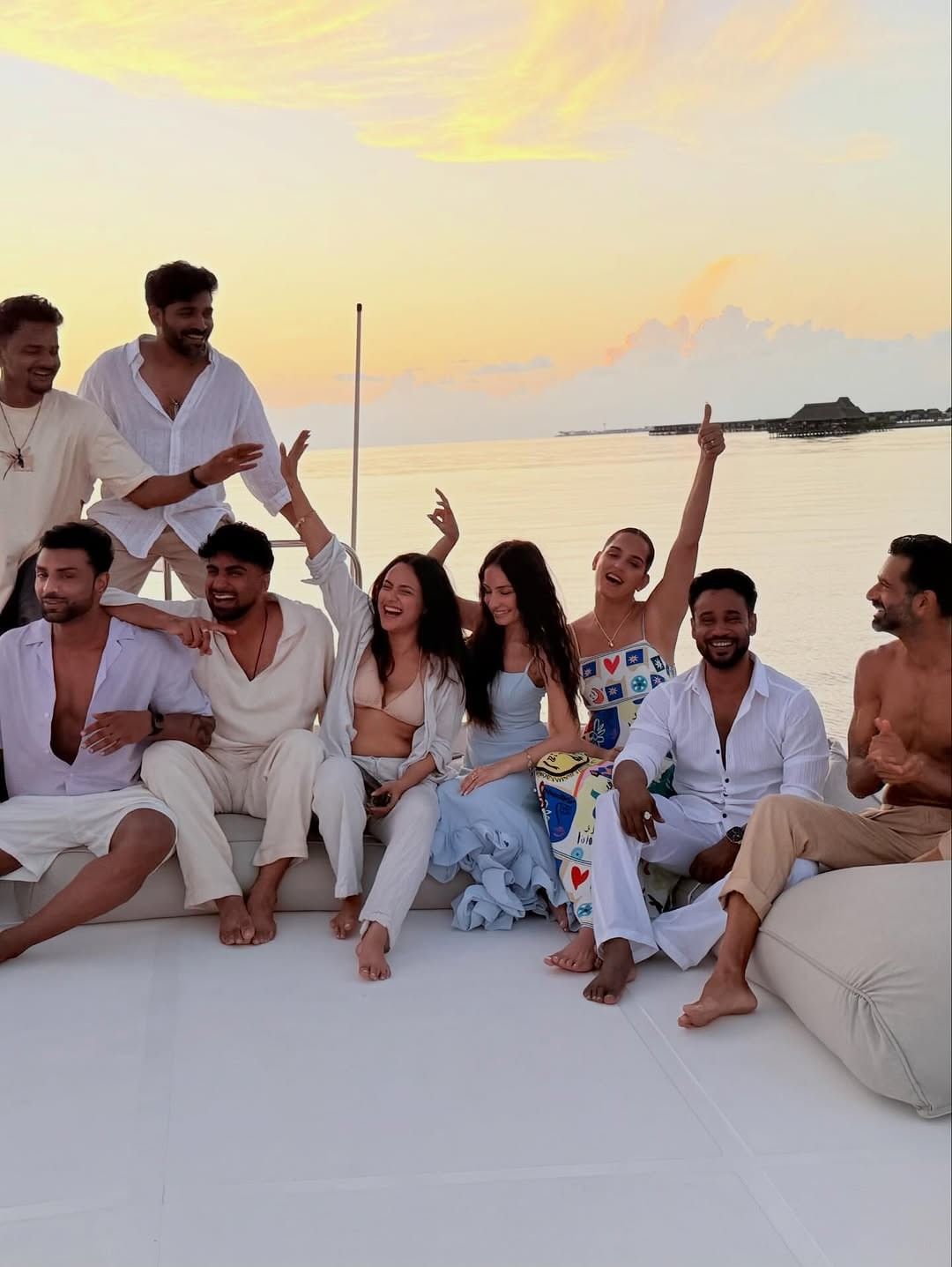 A group of guests enjoying at Grand Park Kodhipparu, Maldives