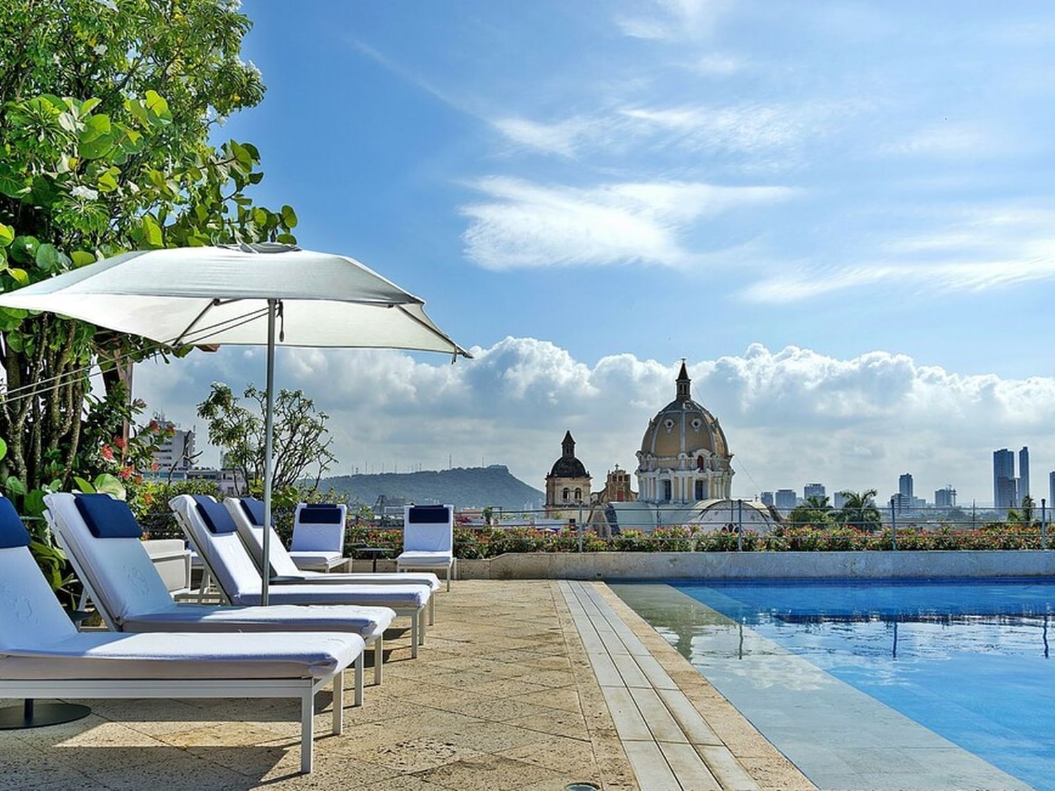 Outdoor pool with pool beds at Hotel Charleston