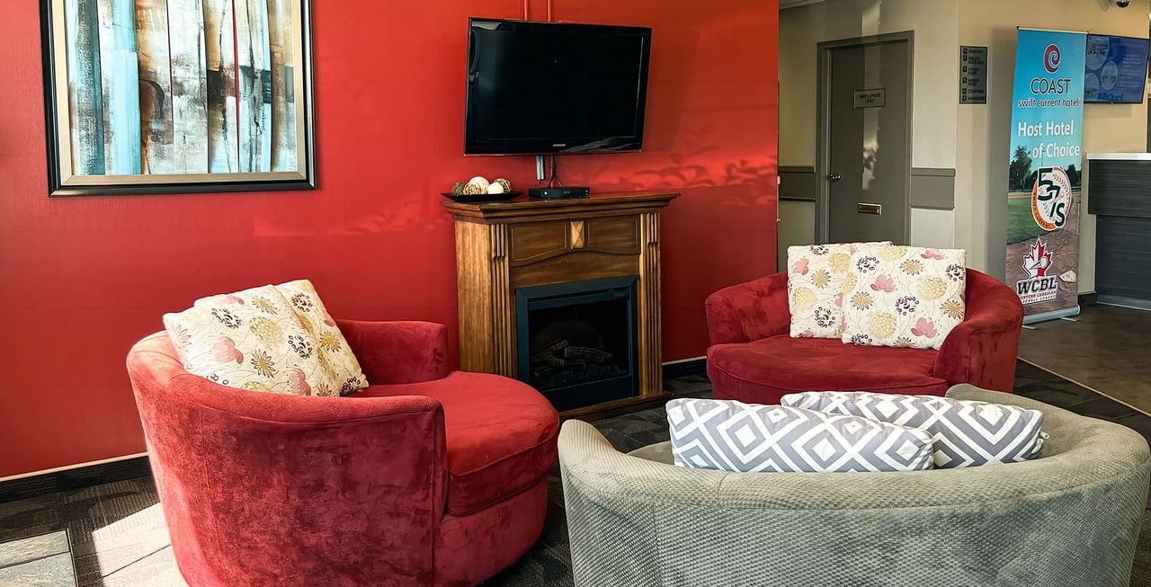 Coast Swift Current Hotel Lobby with couches and TV