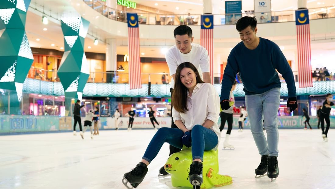 Friends on a slide ride in a shopping mall near Sunway Resort