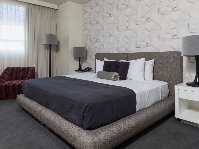 Large comfy bed in the Superior Room at Gamma Hotels