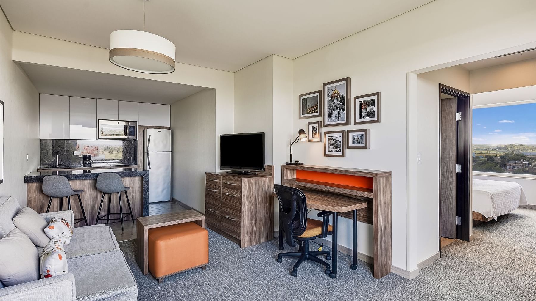Modern interior of the Junior King room at Fiesta Inn Suites Aeropuerto del Bajío