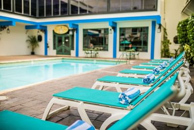 pool lounging chairs by pool