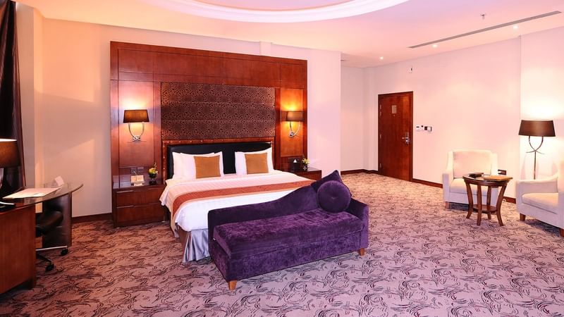 Lounge area & work desk by the bed in Junior Suite at Al Hamra Palace by Warwick Riyadhd