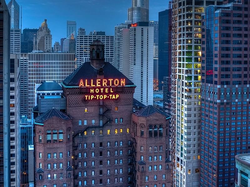 Illuminated top view of Warwick Allerton - Chicago surrounded by skyscrapers