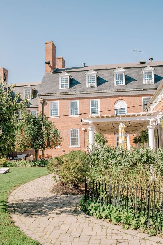 Exterior view of the Exeter Inn with the garden in the daytime