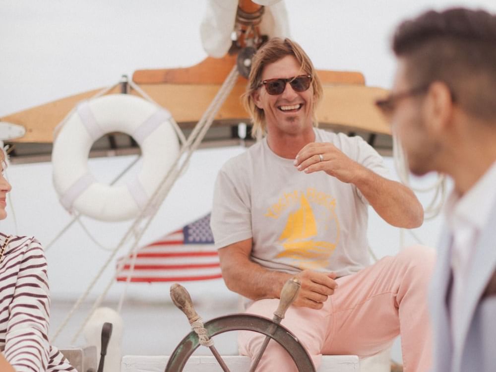 Man laughing from a yacht ship near The Rockaway Hotel