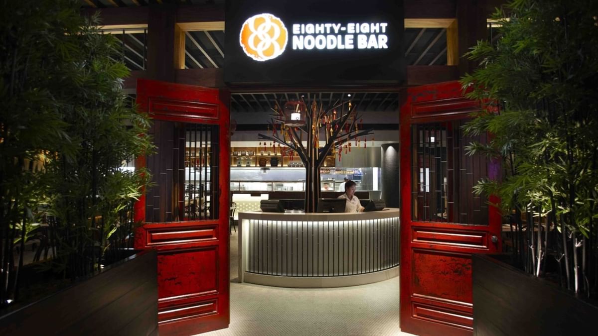Entrance to Eighty Eight Noodle Bar with red gates & interior view at Crown Hotels
