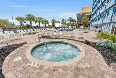 Hot tub with arranged sun beds at The Yachtsman Resort