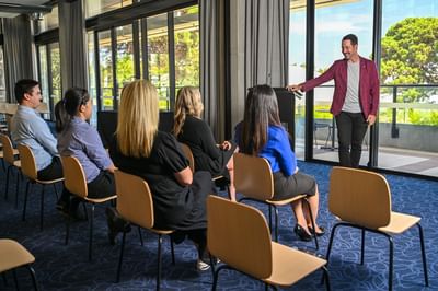Man hosting a meeting in a Meeting Room at Nesuto Curtin Perth